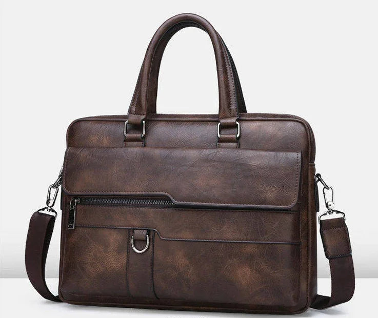 Brown leather briefcase with front zipper pocket, detachable shoulder strap, and double handles