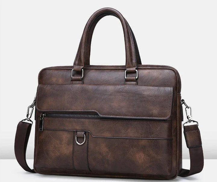 Brown leather briefcase with front zipper pocket, detachable shoulder strap, and double handles