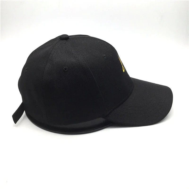Black baseball cap with curved brim and adjustable strap on white background