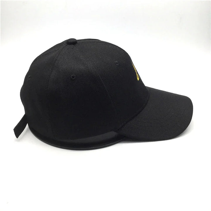 Black baseball cap with curved brim and adjustable strap on white background
