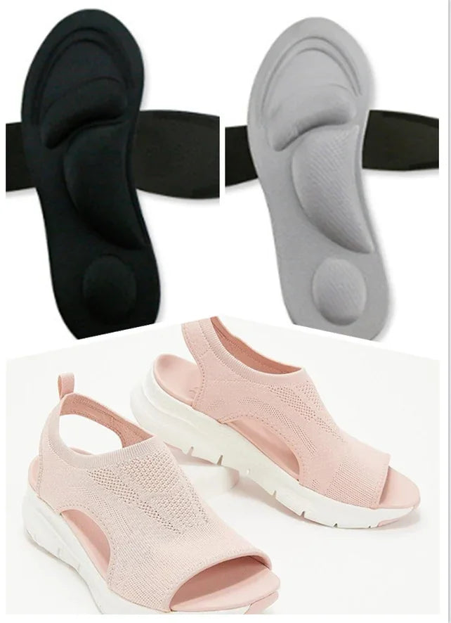 Pink slip-on open-toe sneakers with white sole and black and gray cushioned insoles for arch support