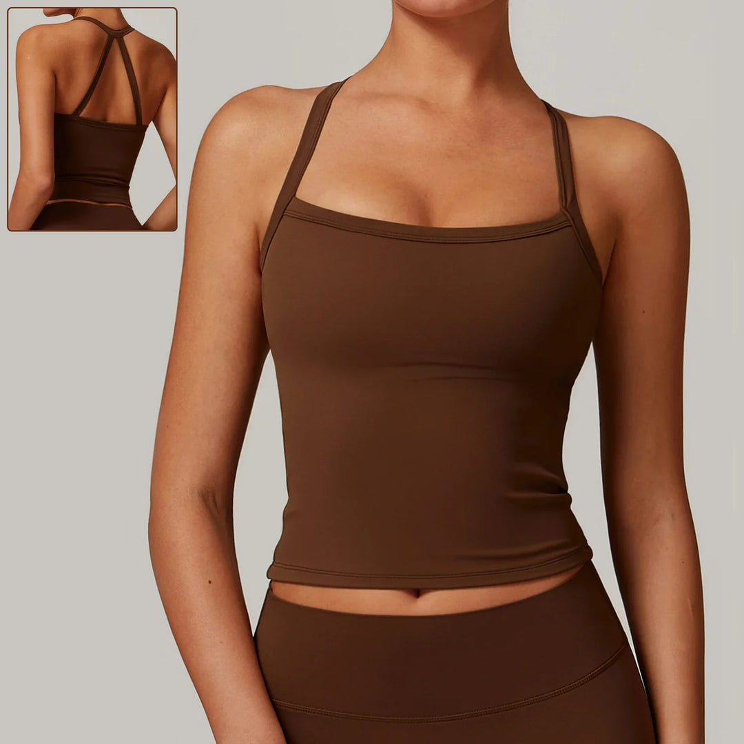 Woman wearing brown seamless tank top and matching leggings with strappy back design