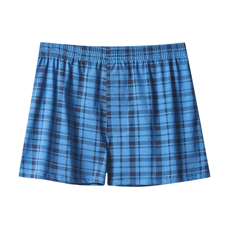 Blue plaid men's boxer shorts with elastic waistband on white background