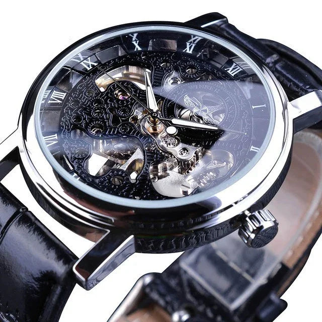 Close-up of a black leather strap skeleton wristwatch with silver Roman numerals and visible gears
