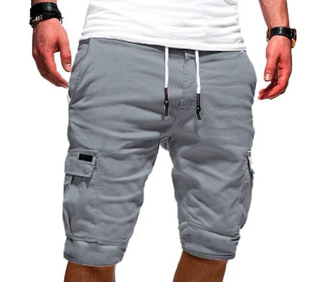 Men's casual grey cargo shorts with drawstring waist worn with white t-shirt