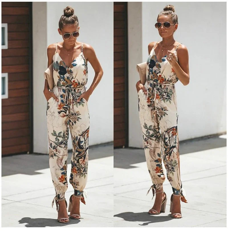 Woman wearing a floral print sleeveless jumpsuit with ankle ties and high heel sandals