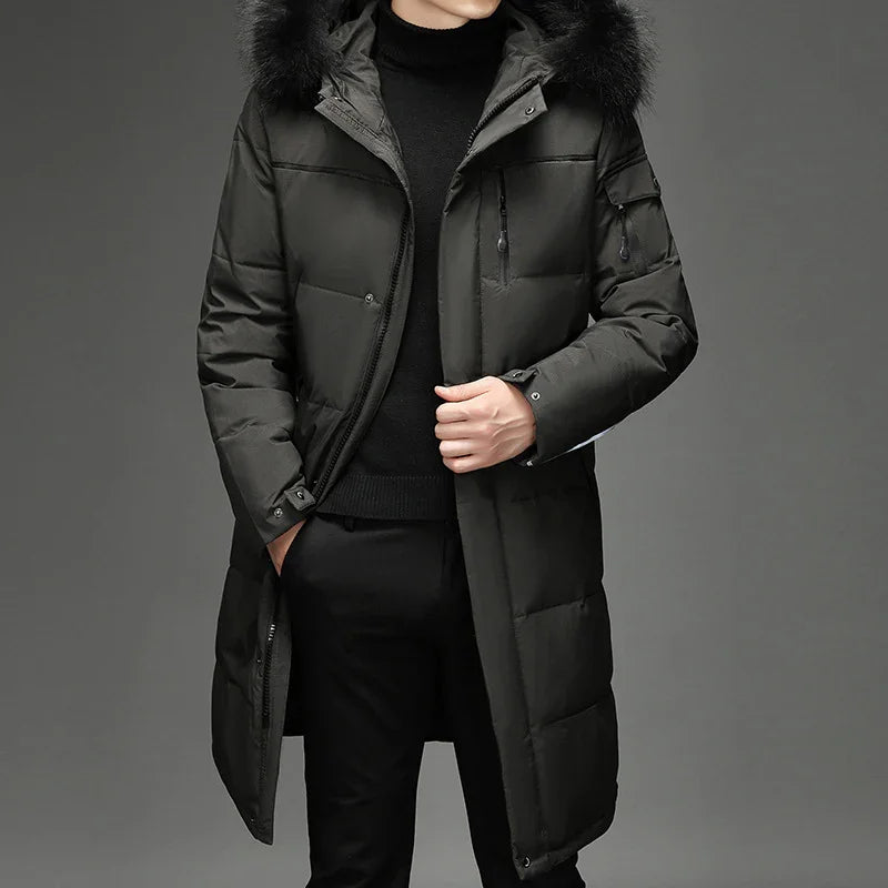 Man wearing long black padded winter coat with fur hood and black turtleneck sweater