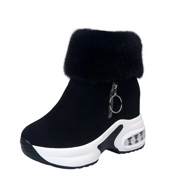 Black wedge sneaker boot with white sole, faux fur cuff, and side zipper with ring pull