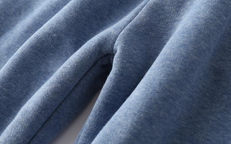 Close-up of soft blue fabric with detailed texture and folds