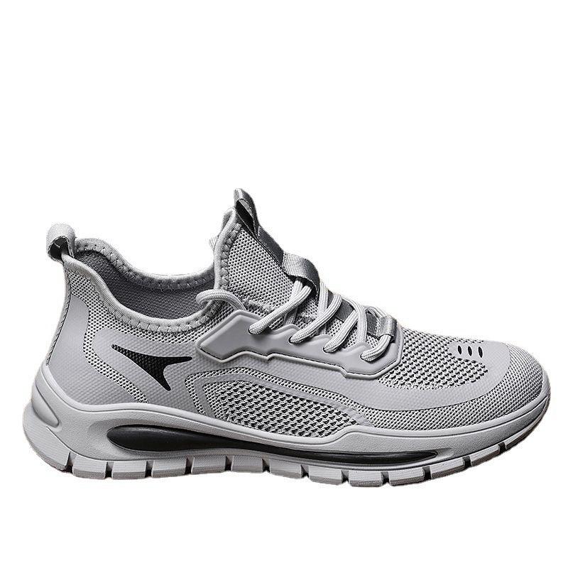 Light gray athletic sneaker with breathable mesh upper and black sole accents
