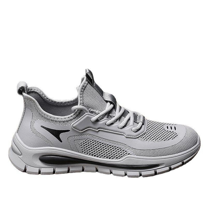 Light gray athletic sneaker with breathable mesh upper and black sole accents