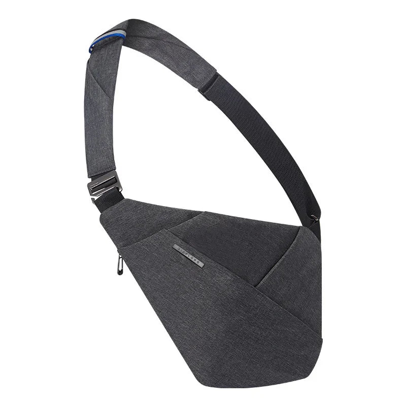 Sleek dark gray crossbody sling bag with adjustable black strap and minimalist design