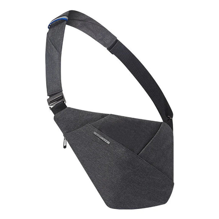 Sleek dark gray crossbody sling bag with adjustable black strap and minimalist design