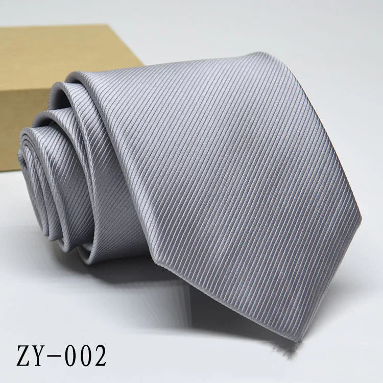 Silver grey striped men's necktie rolled up on white background with product code ZY-002
