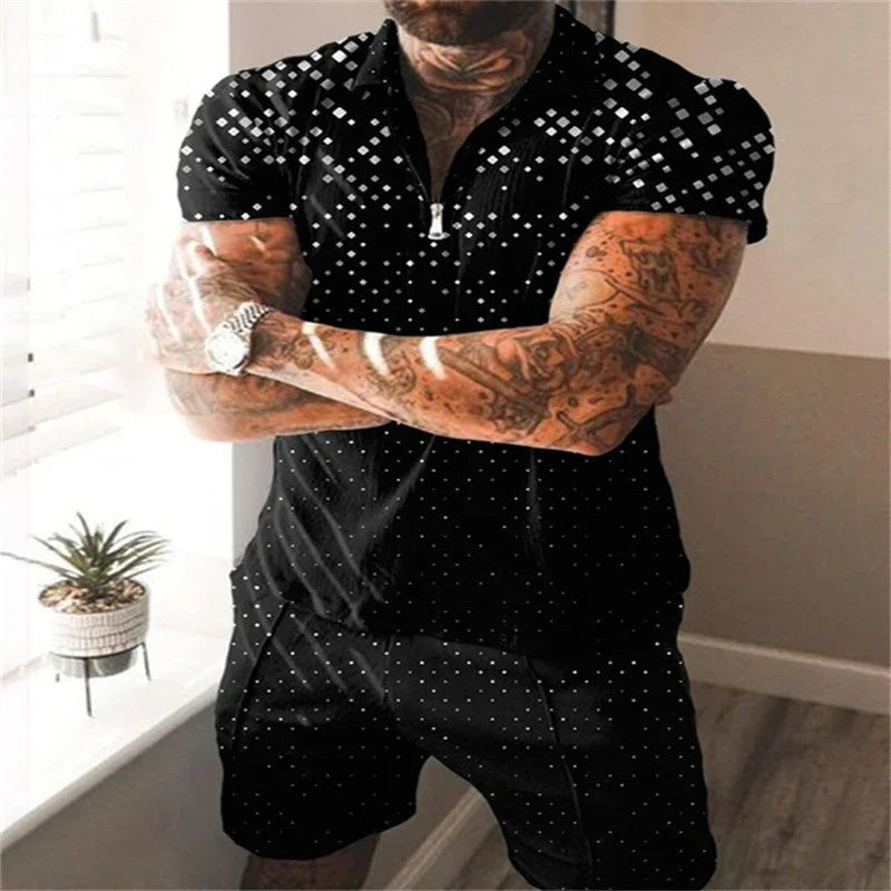 Tattooed man wearing black short-sleeve zip polo and matching shorts with white dot pattern indoors