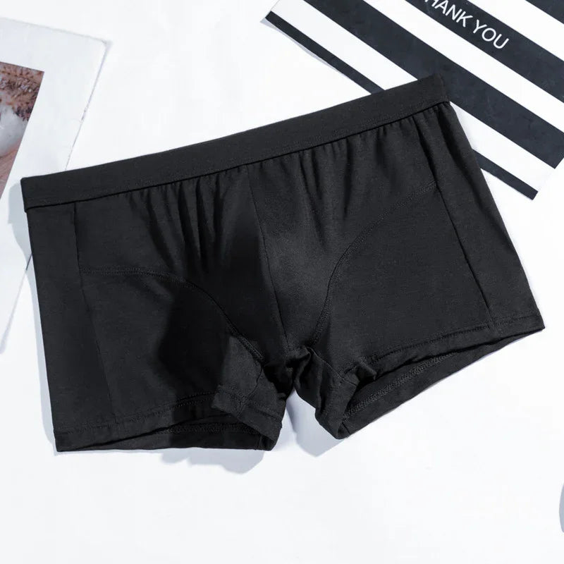 Black men's boxer briefs with elastic waistband on white background