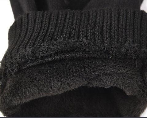 Close-up of black knit fabric cuff with soft fleece lining for warmth and comfort