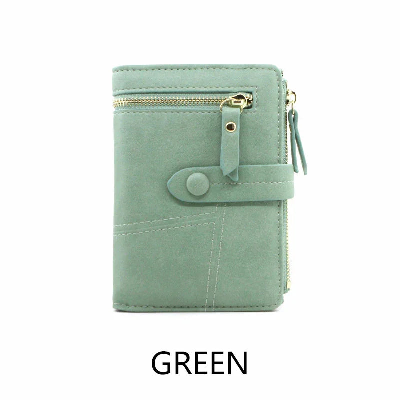 Green suede wallet with gold zipper and snap closure, compact design