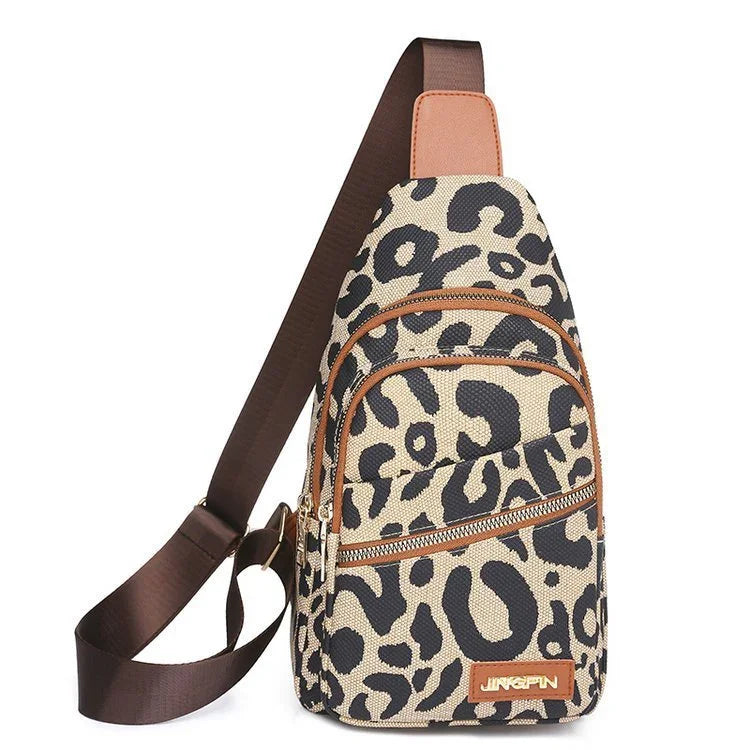 Leopard print sling backpack with brown adjustable strap and front zipper pockets