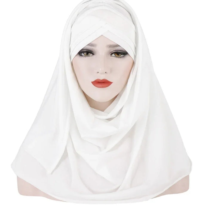 White microfiber hijab with layered design displayed on mannequin head, smooth fabric and modest style