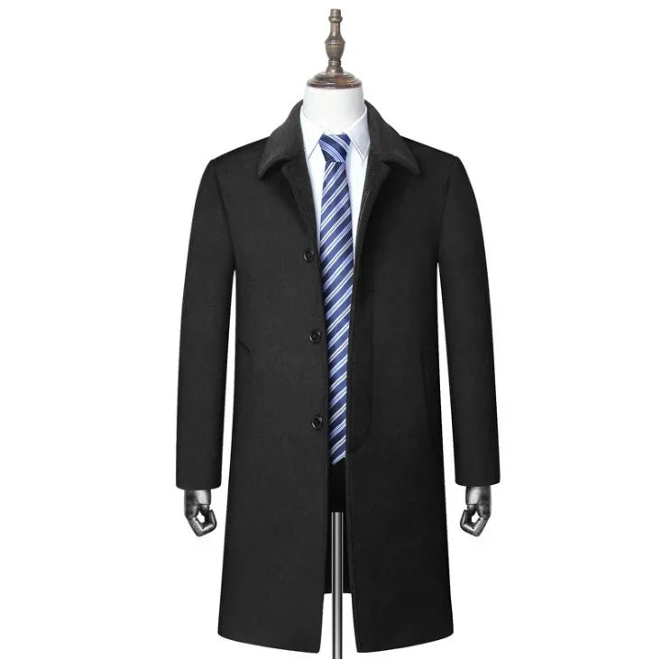Black formal men's overcoat on mannequin with white dress shirt and blue striped tie