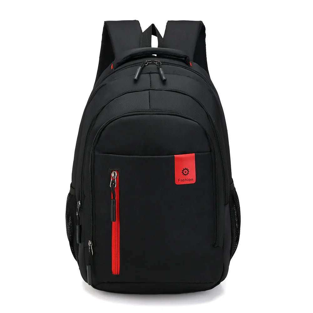 Black fashion backpack with red zipper and front pocket on white background