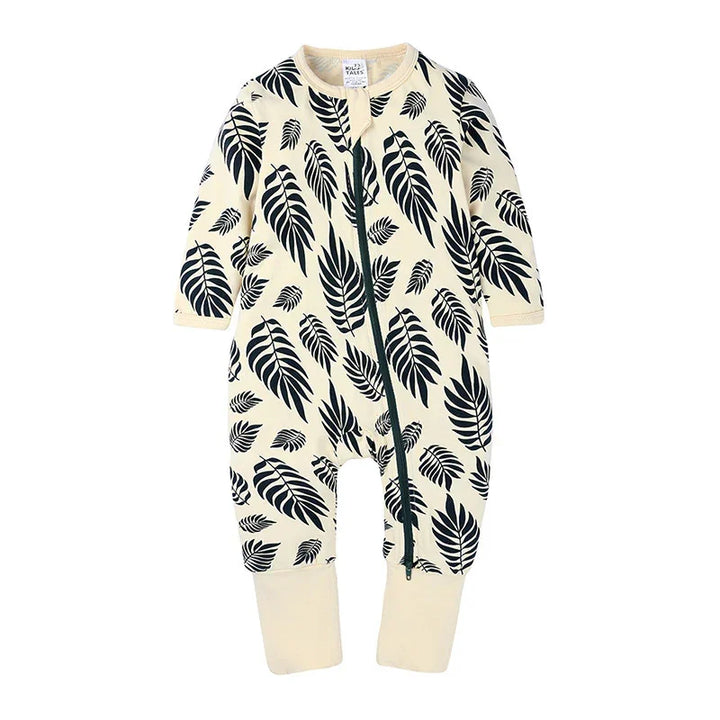 Cream baby romper with black tropical leaf print and front zipper closure