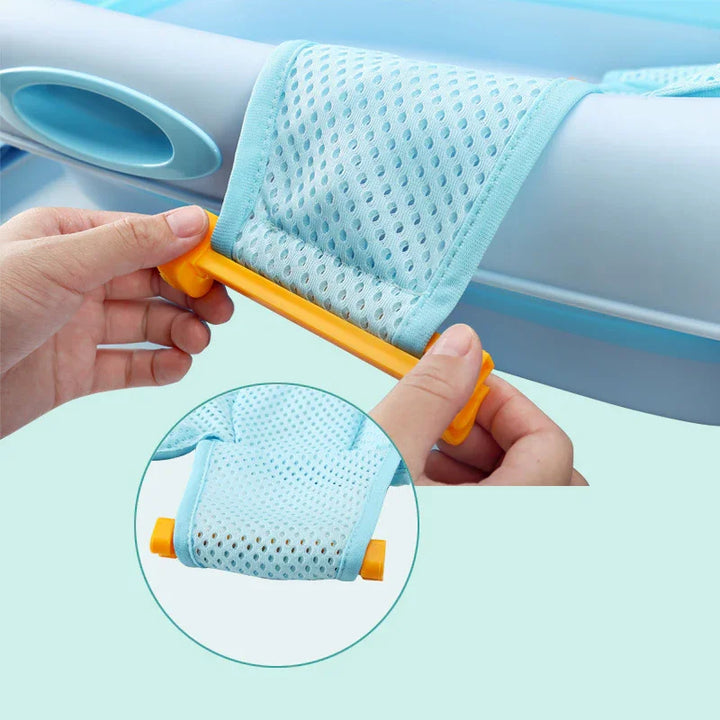 Hands attaching blue breathable mesh fabric to white plastic frame with yellow clips