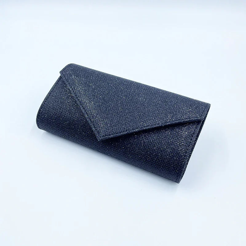 Black glittery envelope clutch purse on white background