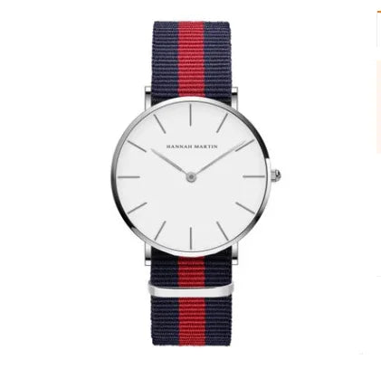 Minimalist wristwatch with white dial, silver case, and navy blue and red striped fabric strap