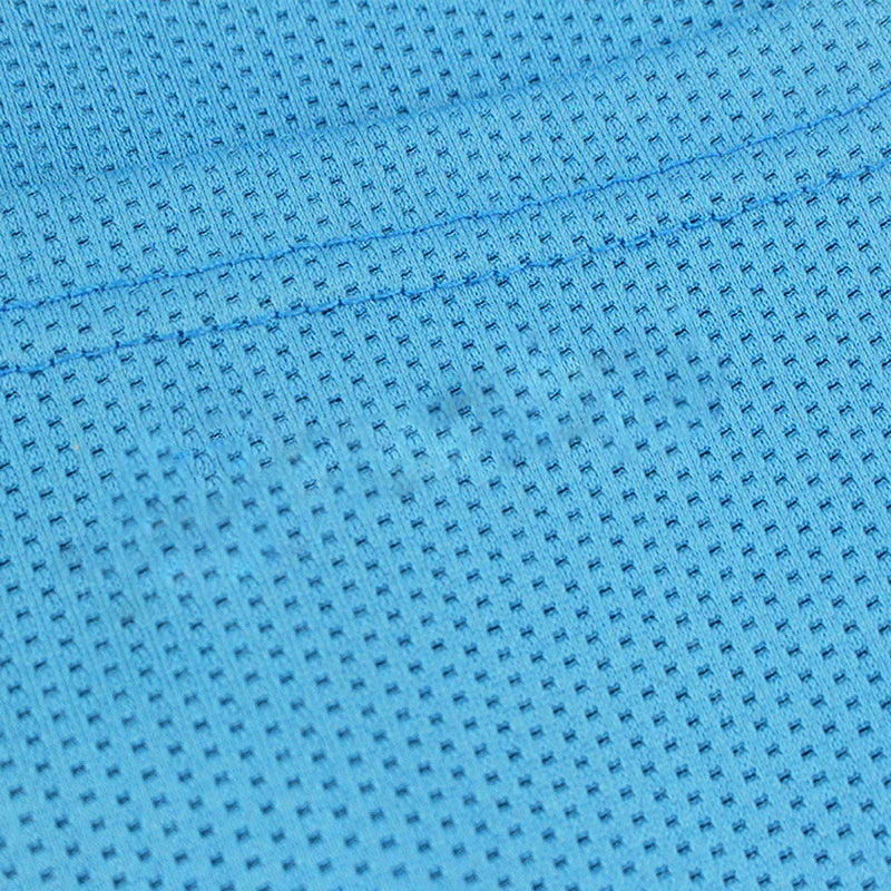 Close-up of blue athletic mesh fabric with visible stitching and textured perforations