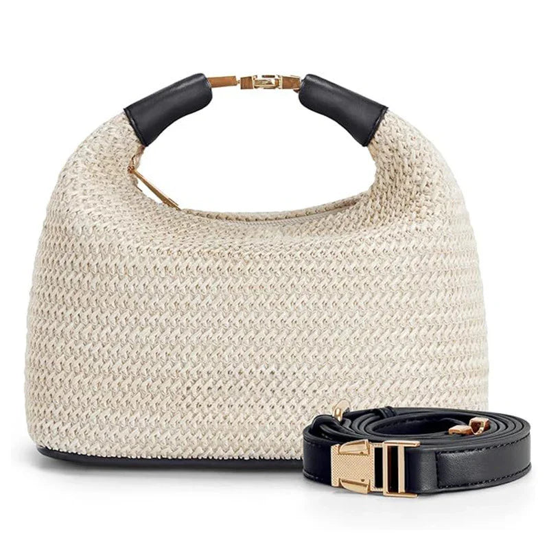 Beige woven handbag with black leather handle accents and detachable black leather strap with gold buckle