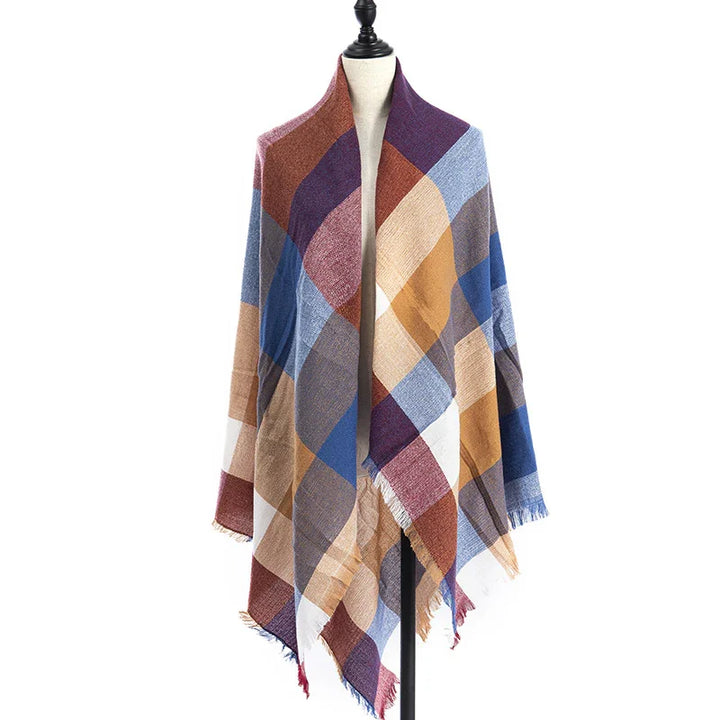 Multicolor oversized plaid shawl with fringed edges displayed on mannequin