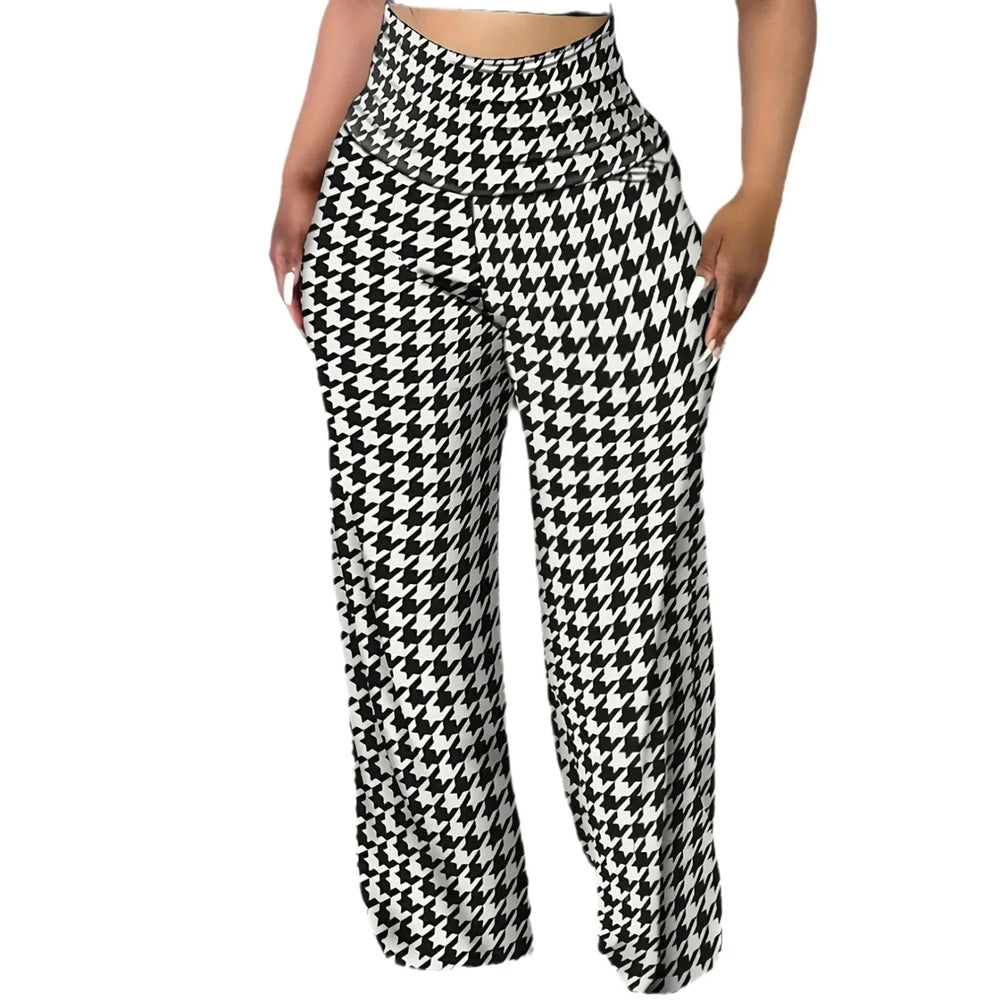 Woman wearing high-waisted wide-leg pants with black and white houndstooth pattern