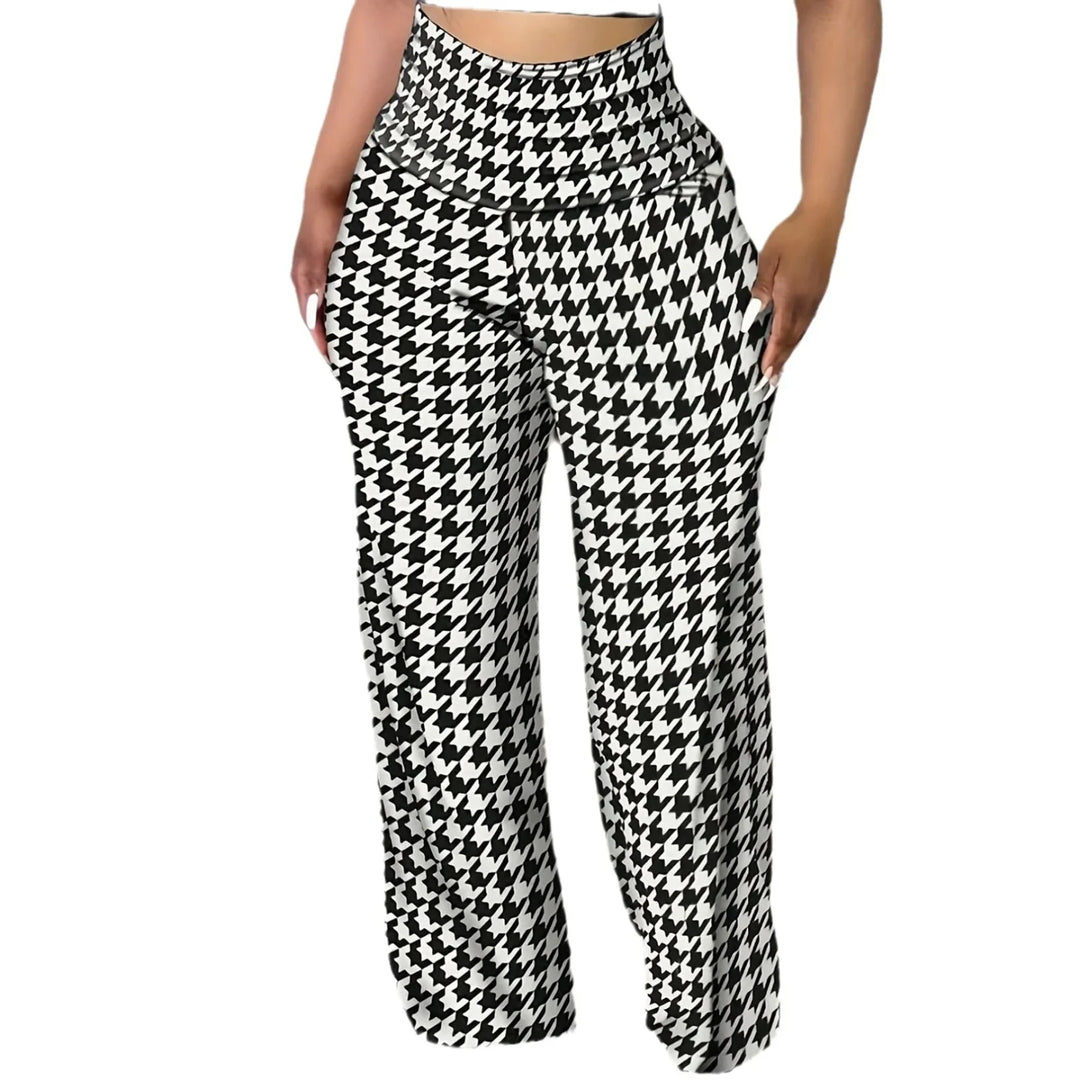 Woman wearing high-waisted wide-leg pants with black and white houndstooth pattern