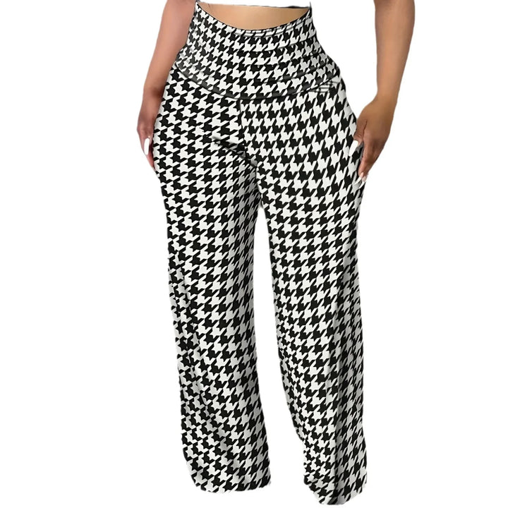 Woman wearing high-waisted wide-leg pants with black and white houndstooth pattern