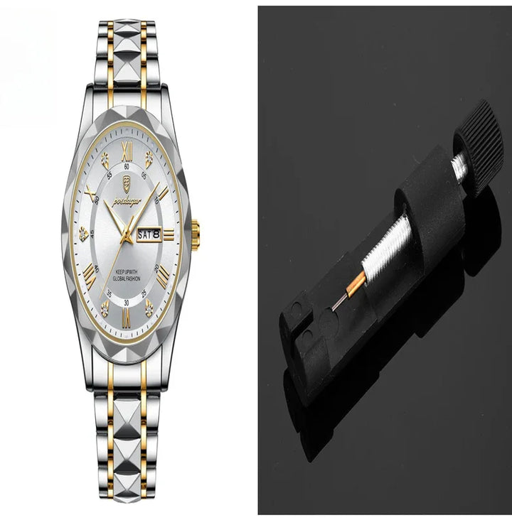 Silver and gold wristwatch with roman numerals and date display next to a black watch repair tool