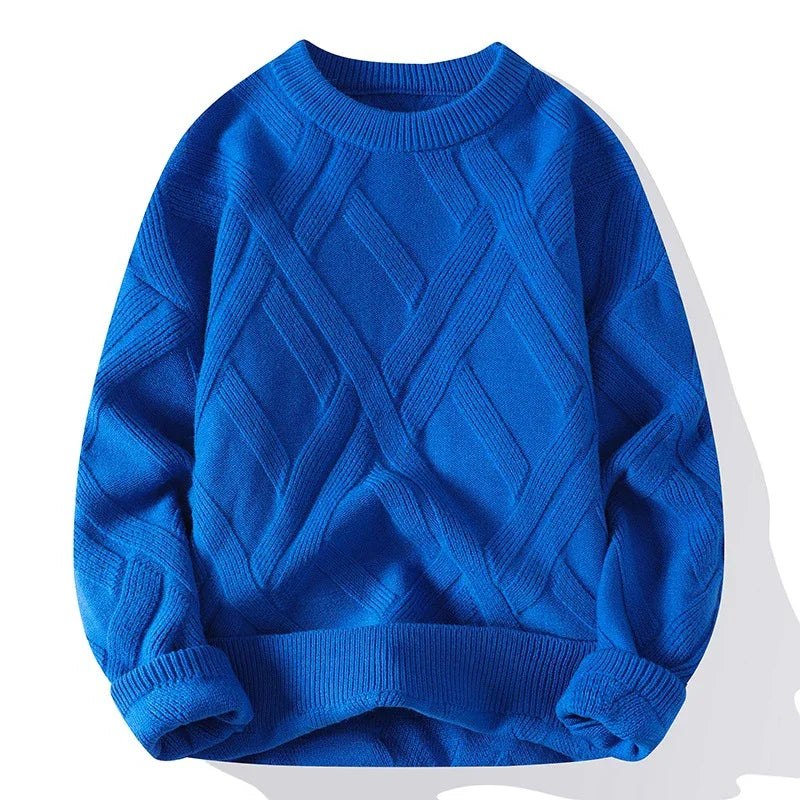 Bright blue knitted sweater with geometric diamond pattern and ribbed cuffs and hem