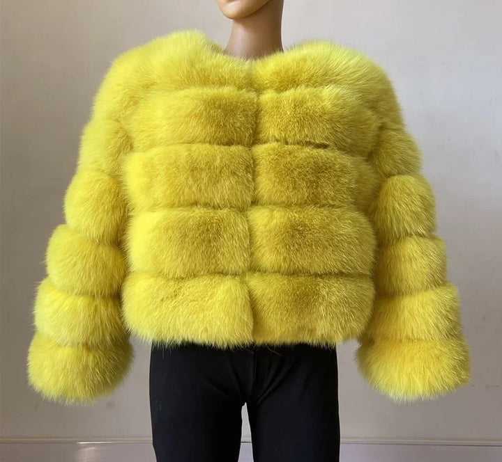 Yellow fluffy faux fur jacket with horizontal quilted segments and long sleeves on mannequin