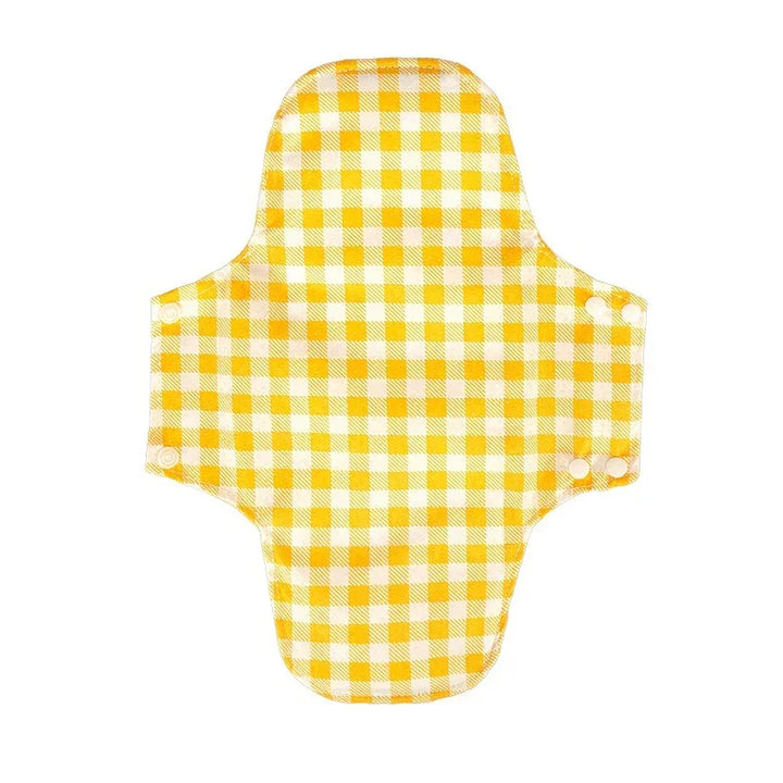 Yellow and white checkered reusable cloth menstrual pad with snap buttons on white background