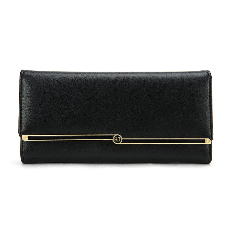Black leather clutch wallet with gold bar detail and HT logo on front