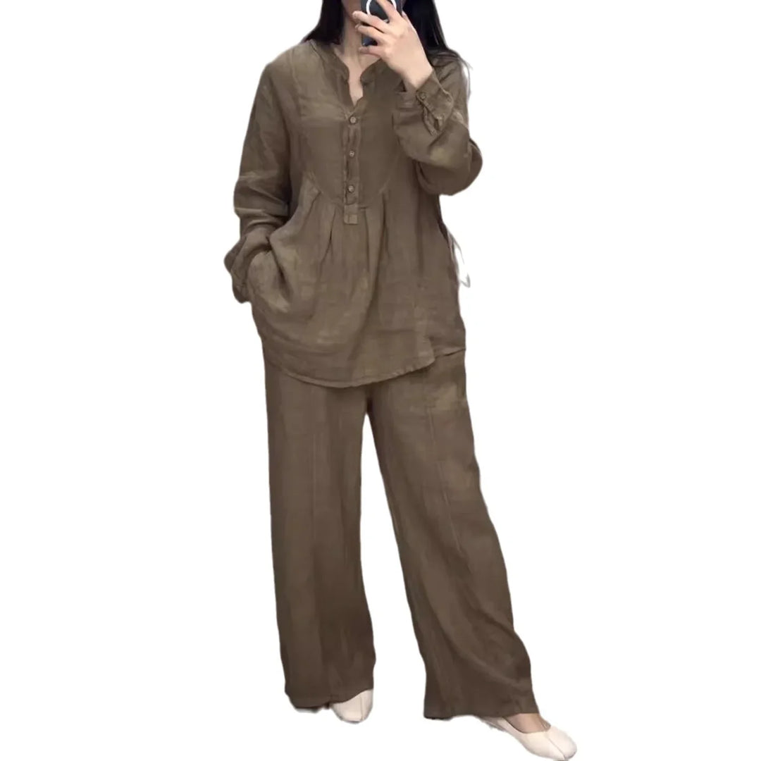 Woman wearing loose brown linen two-piece outfit with long sleeves and wide-leg pants