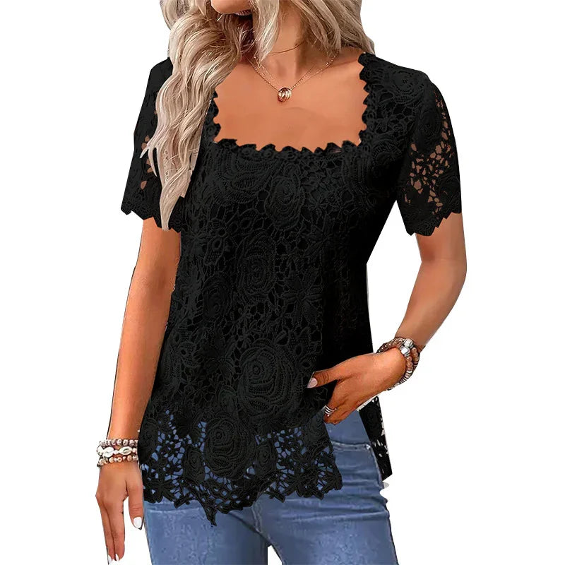 Woman wearing black lace short-sleeve top with scalloped neckline and hem, paired with blue jeans