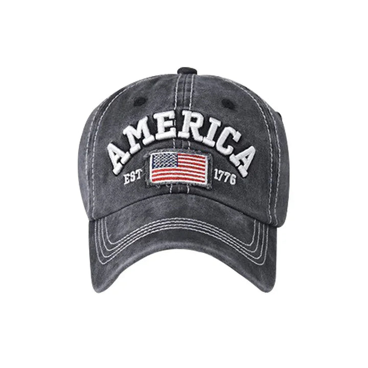 Dark gray baseball cap with embroidered American flag and text America EST 1776