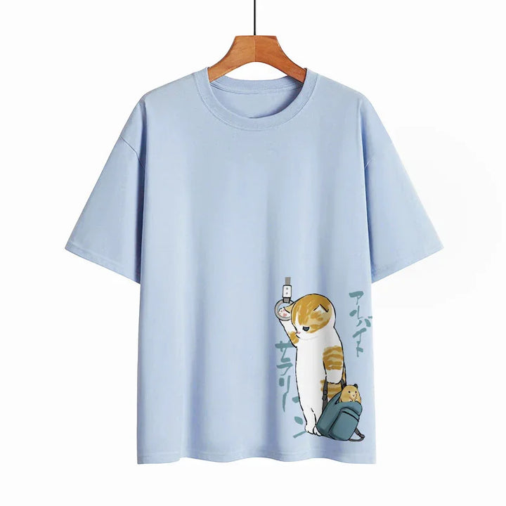 Light blue T-shirt with cartoon cat holding subway strap and carrying a backpack with a hamster