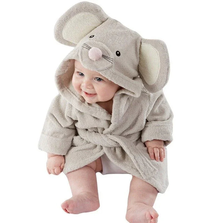 Smiling baby wearing soft mouse-themed hooded bathrobe with ears and nose detail