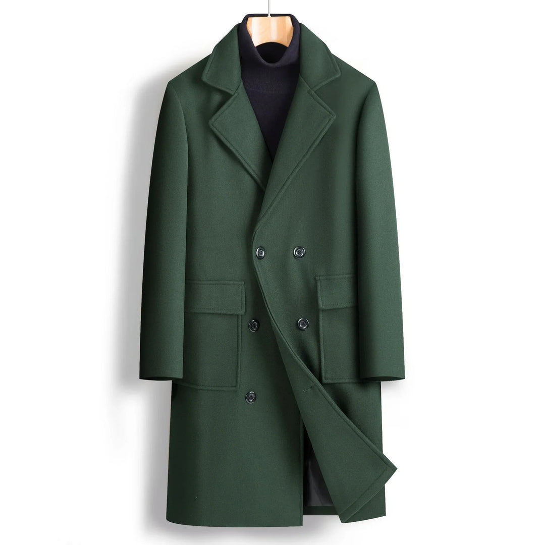Dark green double-breasted wool overcoat with notched lapels and flap pockets on wooden hanger