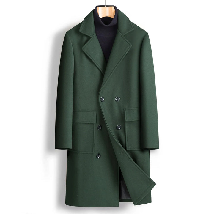 Dark green double-breasted wool overcoat with notched lapels and flap pockets on wooden hanger