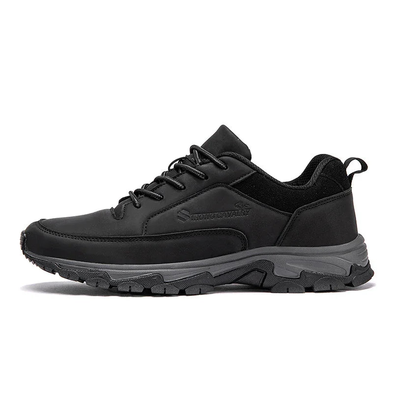 Black low-top athletic sneaker with gray rugged sole and lace-up design