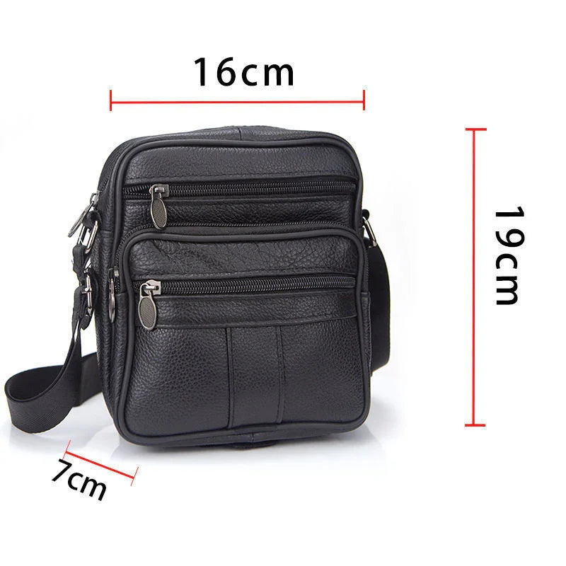 Compact black leather crossbody bag with multiple zippered pockets and adjustable strap, dimensions 19x16x7 cm